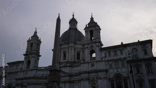 Low-angle view of 17th-century church Sant'Agnese in Agone - SantAgnese in Piazza Navona, one of main urban spaces in historic centre, on background of sky, no people. Shooting in slow motion. photo