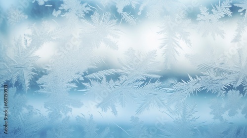 Beautiful frosty winter pattern on glass with blurred cloudy day on background behind © shooreeq
