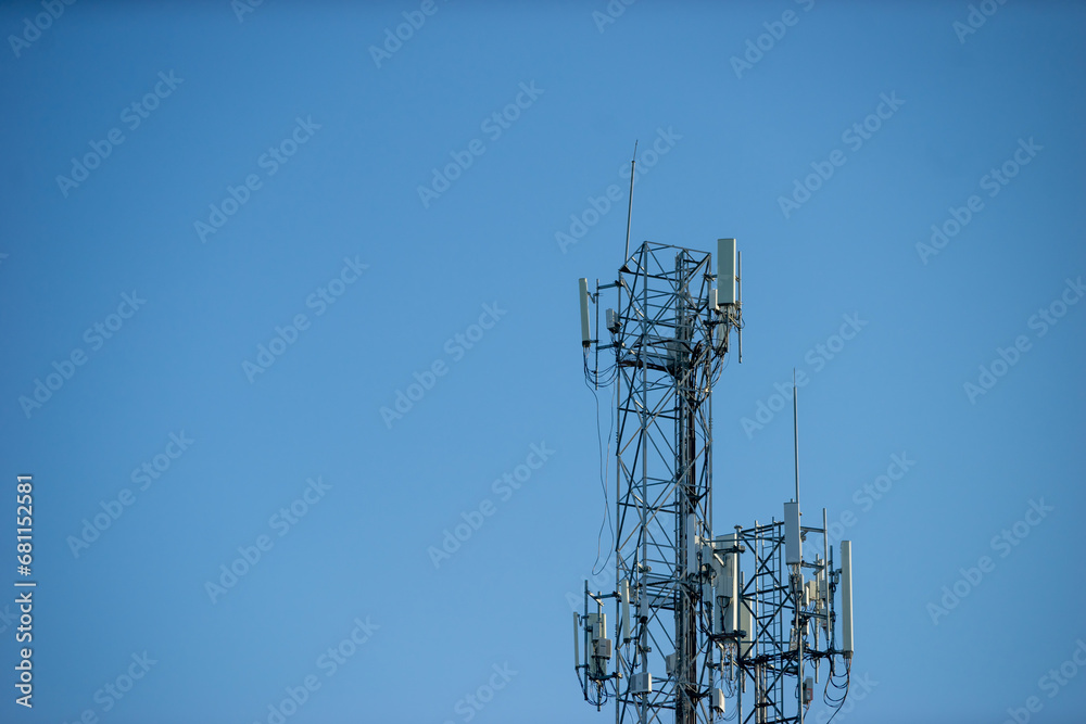 Telecommunication tower with blue sky and white clouds, technology background. Telecommunication tower with blue sky and white clouds, technology background.