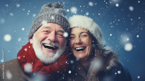 couple in christmas hats against snowy bokeh in winter 