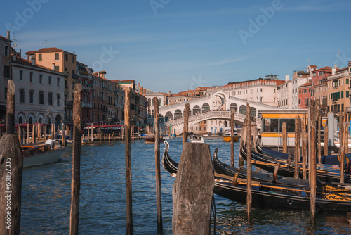 Scenic view of the Grand Canal in Venice, Italy, with moored gondolas. Iconic and tranquil, showcasing the beauty of the historic city and its famous waterways.