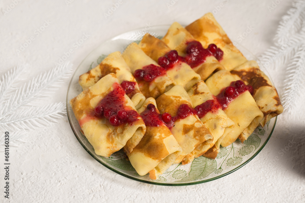 Pancakes stuffed with cheese with cranberry sauce, winter dessert Pancakes stuffed with cheese with cranberry sauce, winter dessert