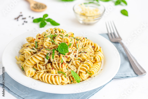 Fusilli Pasta withe Cheese and Basil Close-Up Photo