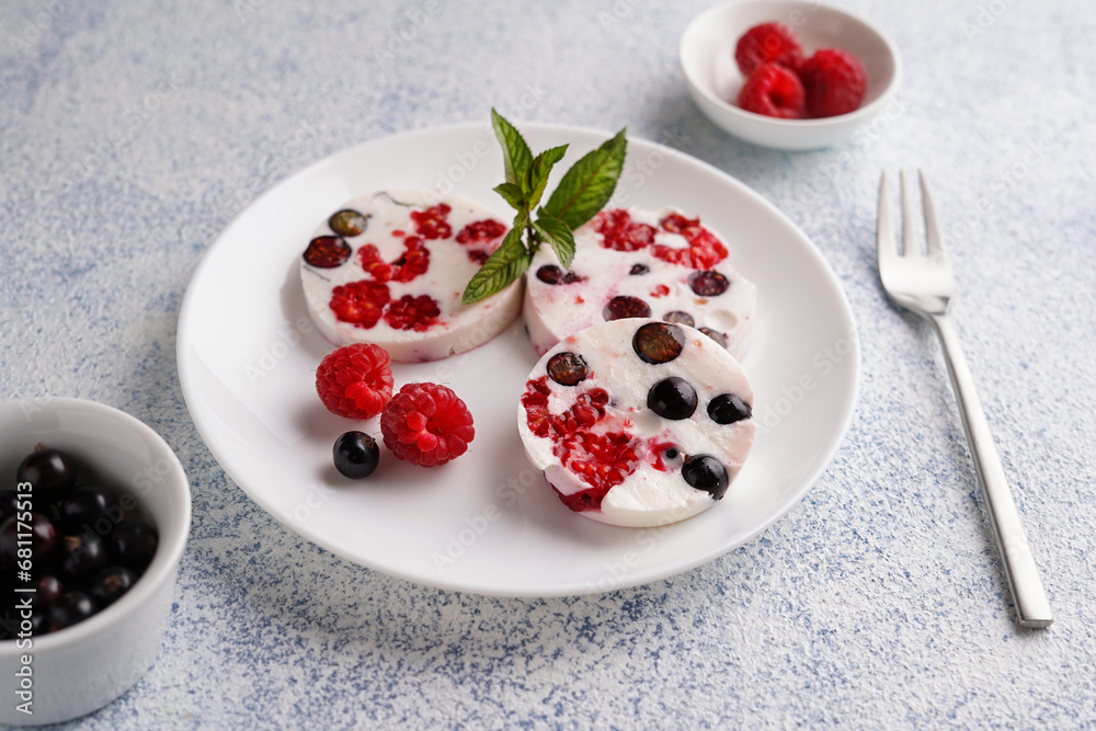 creamy dessert with berries, raspberries and currants on a white plate, close-up, no people, minimalism creamy dessert with berries, raspberries and currants on a white plate, close-up, no people, minimalism
