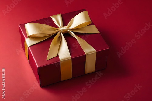 Red gift box with gold satin ribbon