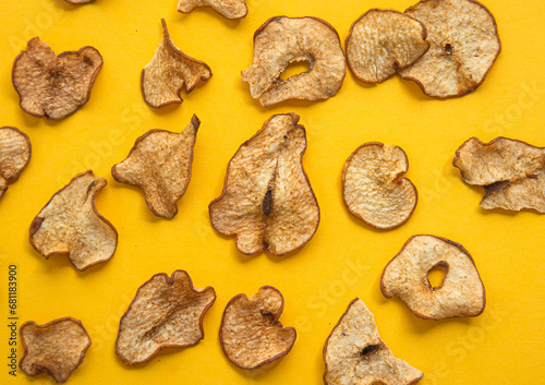 Dried pear slices on a light background. View from above.