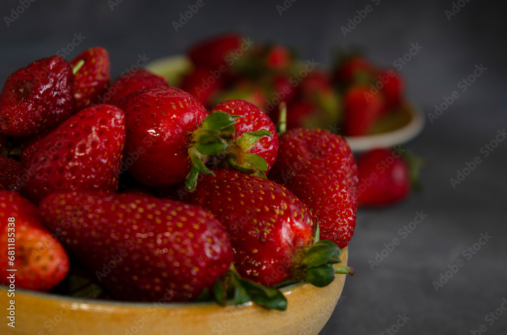 strawberries in fresh fruit close-up with gray background strawberries in fresh fruit close-up with gray background