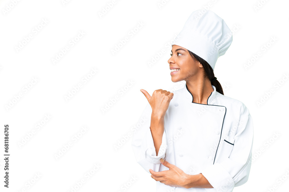 Young African American chef over isolated chroma key background pointing to the side to present a product Young African American chef over isolated chroma key background pointing to the side to present a product