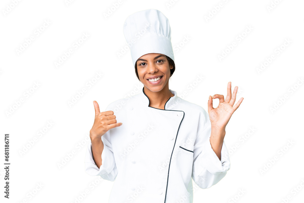 Young African American chef over isolated chroma key background showing ok sign and thumb up gesture Young African American chef over isolated chroma key background showing ok sign and thumb up gesture