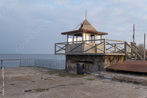 An observation deck on top of a military fortification overlooking the sea