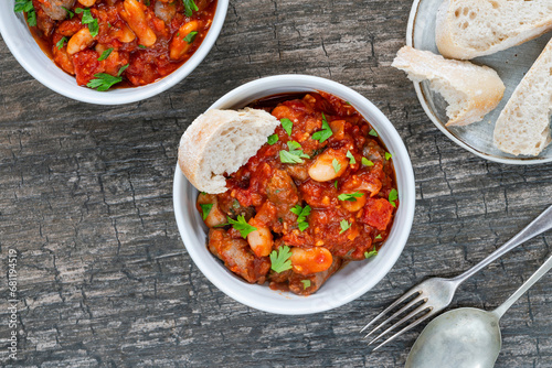 Beef chipolatas and bean casserole with crusty bread