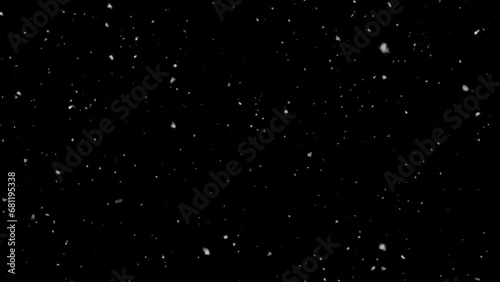 Isolated snow falling on black background photo