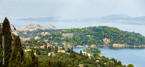 Fototapeta Naklejka Na Ścianę i Meble -  View from the former villa of Empress Sissi Achilleion over forests of cypress and olive trees to the city of Corfu