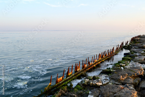 old wooden pier on the Baltic spit  Baltiysk  Kaliningrad region  beautiful sunset on the sea