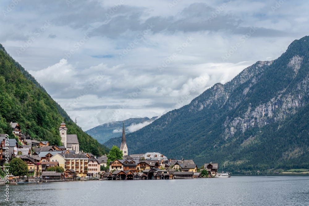 Picturesque cityscape featuring a clock tower and a mountainous backdrop: Hallstatt