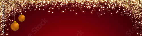 Christmas background with blurred lights and golden balls isolated on red .
