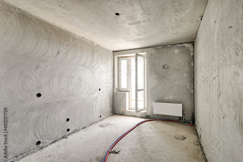 Bild auf Leinwand Empty room without renovation, no repair in a new apartment building