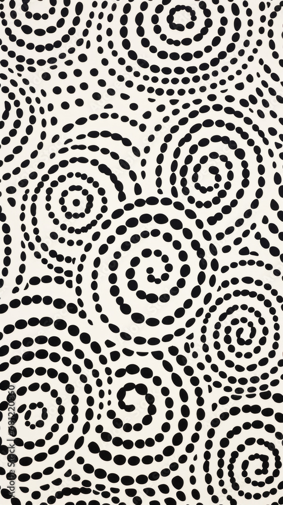 A pattern of white and black polka dots in a circular pattern A pattern of white and black polka dots in a circular pattern