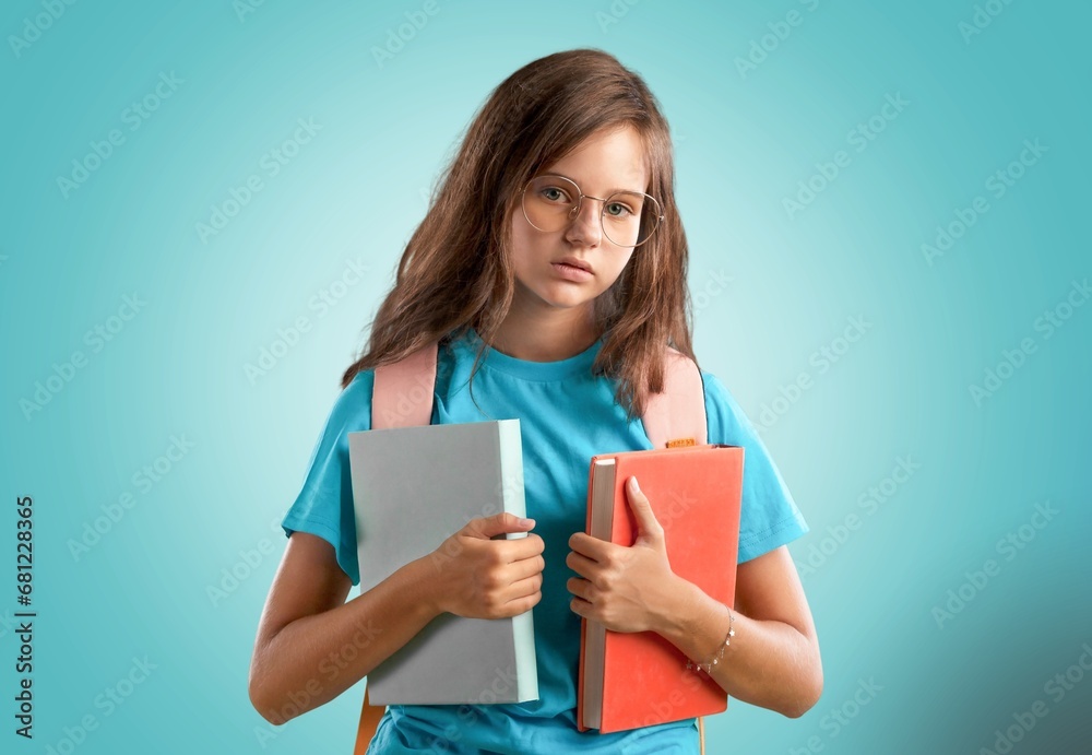 Happy small Student holding notebooks. Happy small Student holding notebooks.