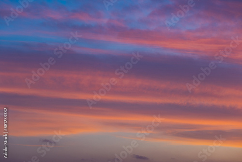 Beautiful layer of clouds on sunset sky. © AlexandraDaryl