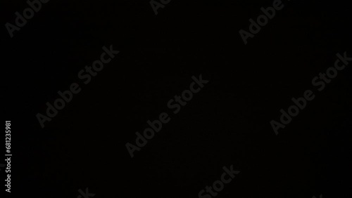 The frame depicts an abstract on a black background, isolated. Fire, glare, moves in the frame, flickering and shivering. A smooth transition, gradient is created. Used for screensavers, backgrounds photo