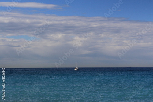 Boat sailing in a turquoise ocean in Cassis, France