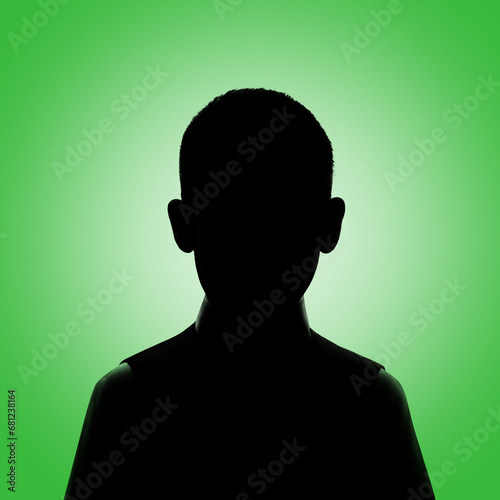 Silhouette of a boy. Boy's avatar. Boy posing on a green.