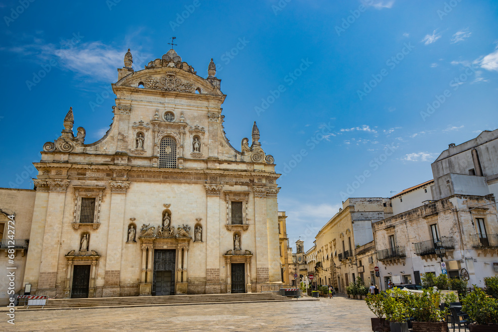 Fototapeta premium Galatina, Lecce, Puglia, Italy. Ancient village in Salento. The wonderful Church of Saints Peter and Paul, in baroque style. Many marble statues and sculptures adorn the facade of the church.