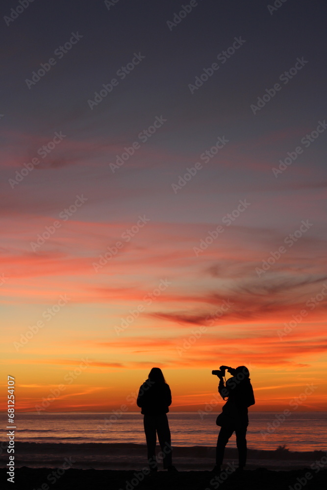 silhouette of a couple on the beach, photographers