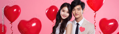 Asian couple with heart balloons on Valentine's Day poster with copy space.