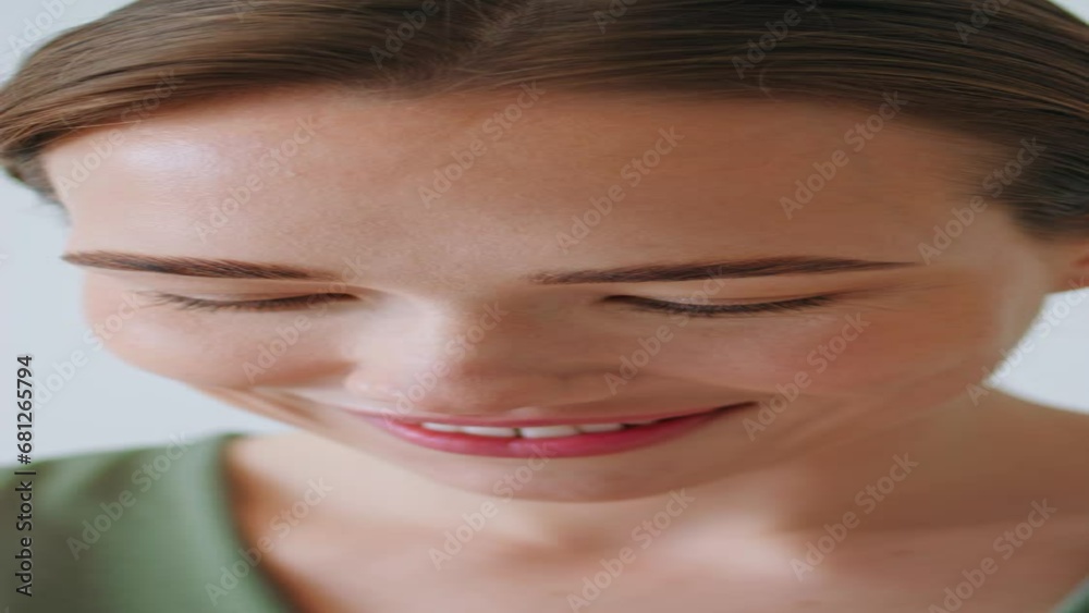 Closeup woman looking mobile phone. Smiling attractive girl raising eyes posing Closeup woman looking mobile phone. Smiling attractive girl raising eyes posing