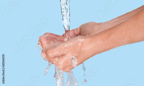 Hands in soft white soap foam