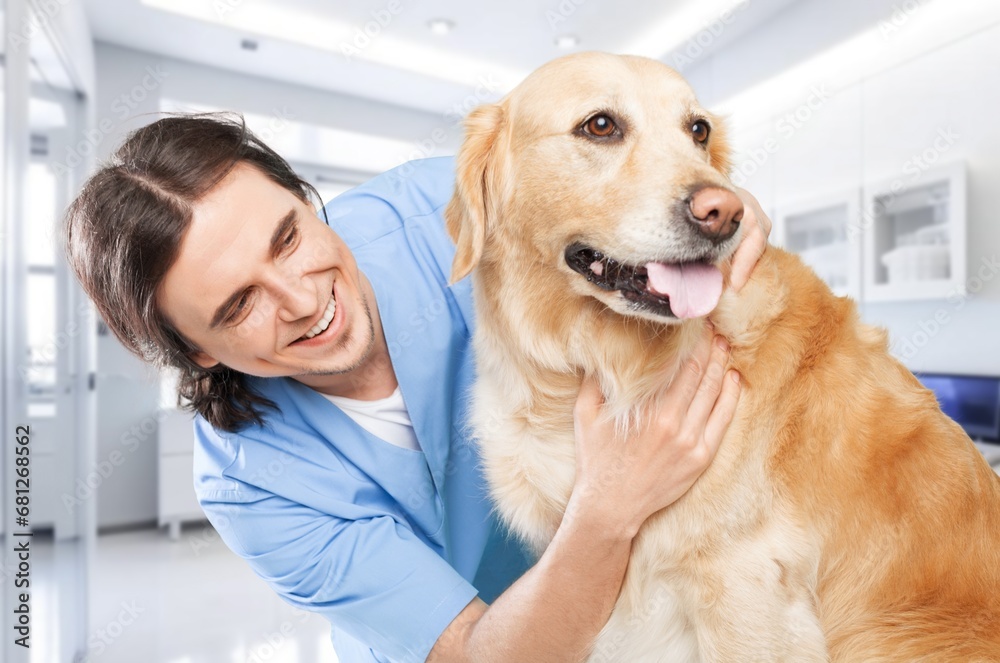 Happy vet doctor in uniform with little dog