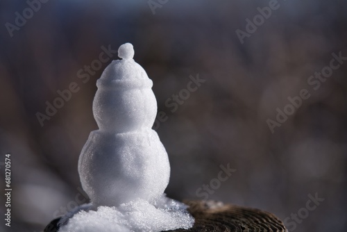 Hokkaido, Japan - November 16, 2023: A small snowman in Hokkaido, Japan  © Khun Ta