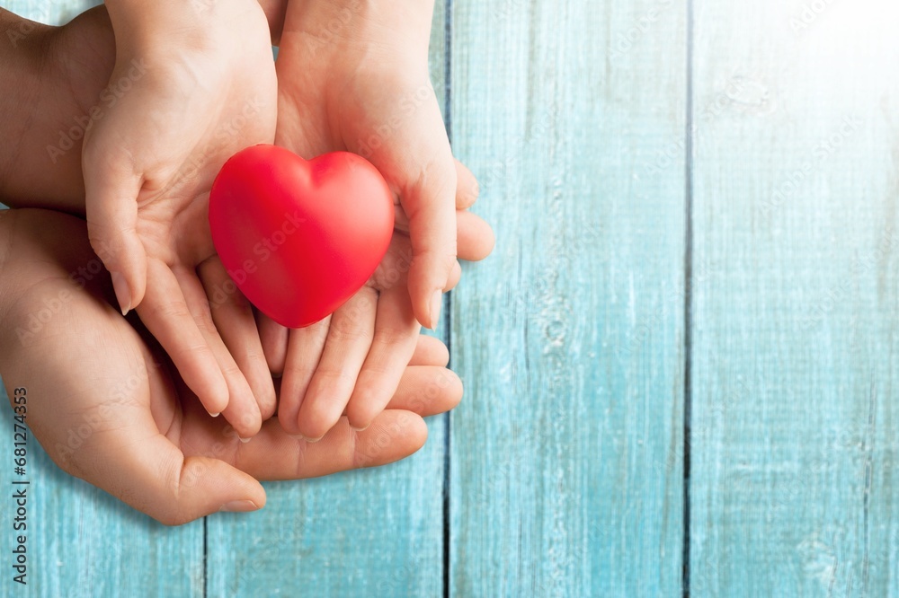 cardiology concept heart health red toy in hands cardiology concept heart health red toy in hands