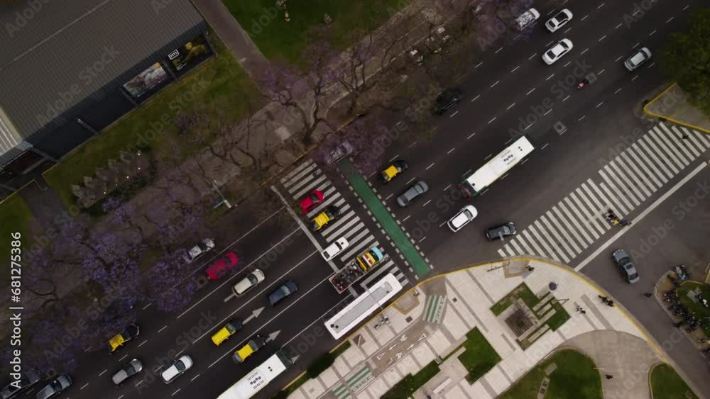 Top view, diagonal frame, cars driving in one direction along a highway in Buenos Aires, bright rich colors Top view, diagonal frame, cars driving in one direction along a highway in Buenos Aires, bright rich colors