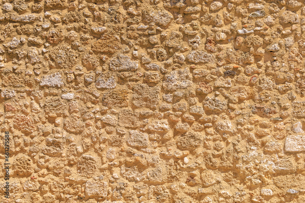 Rough textured surface of the wall of an ancient city. Background with selective focus and copy space Rough textured surface of the wall of an ancient city. Background with selective focus and copy space