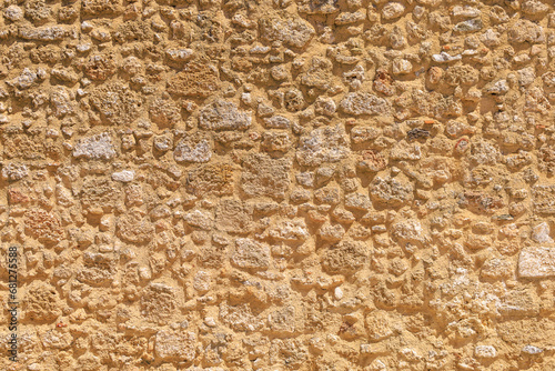 Rough textured surface of the wall of an ancient city. Background with selective focus and copy space