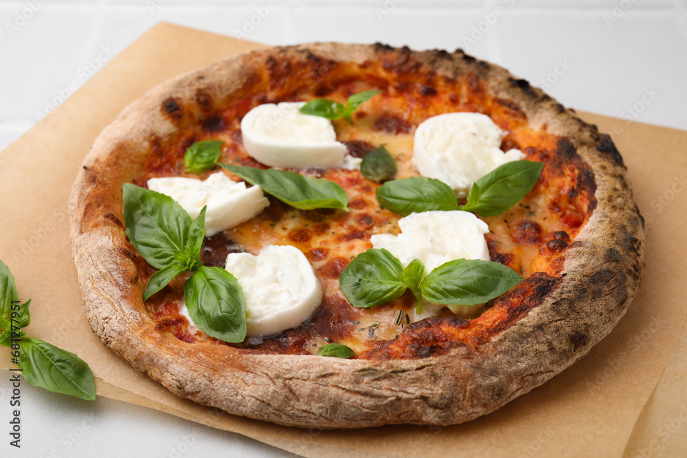 Delicious pizza with burrata cheese and basil on white table, closeup Delicious pizza with burrata cheese and basil on white table, closeup