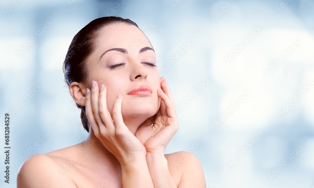 Portrait of beautiful young woman touching clean face Portrait of beautiful young woman touching clean face