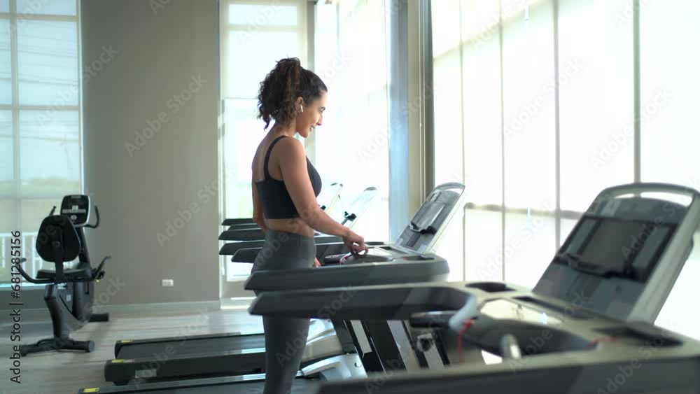 Hispanic beautiful woman exercising in fitness club. Hispanic beautiful woman exercising in fitness club.