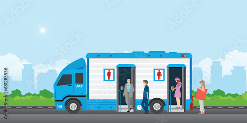 People queue to enter the toilet bus or mobile toilet.