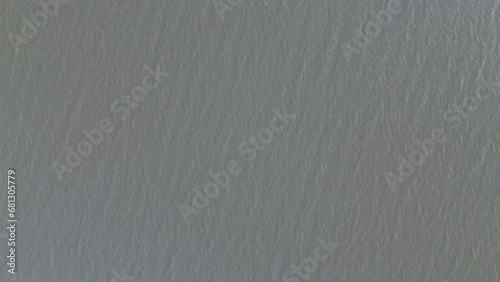 Aerial view over the water of the lake . Aerial view of lake. Flying over water. Flight over calm lake surface photo