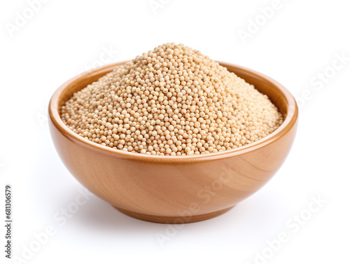 Quinoa in a bowl isolated on white.