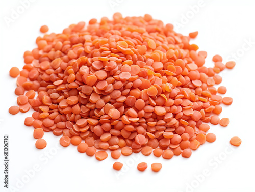 Red split lentils isolated on white.