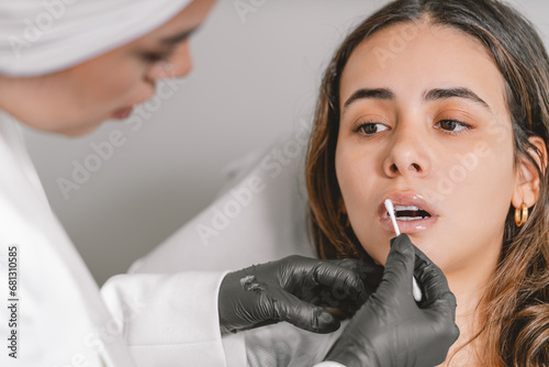 Woman after having a hyaluronic acid injection in lips