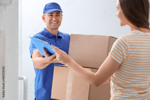 Young woman receiving parce...