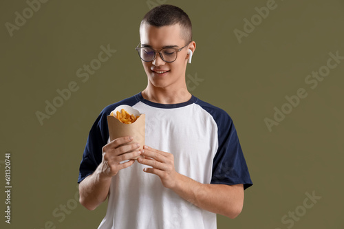Young man in earphone with ...