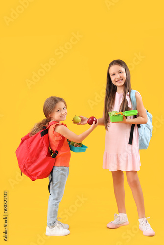 Happy girls with apples and...