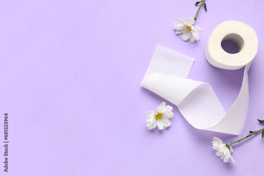Roll of toilet paper with beautiful chamomile flowers on lilac background Roll of toilet paper with beautiful chamomile flowers on lilac background